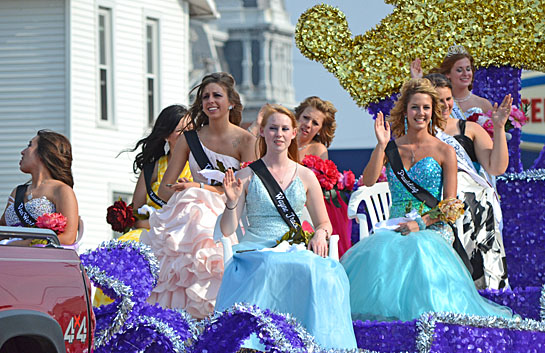 Queen Jubilee XXXIII Mari Young and her court wave to the crowd during Saturday's Peony Festival Grand Parade. Many more photos will be in sometime this week. (Dave Mosier/Van Wert independent)