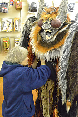 Judy Geary makes some last-minute repairs to one of her costumes. (Dave Mosier/Van Wert independent)