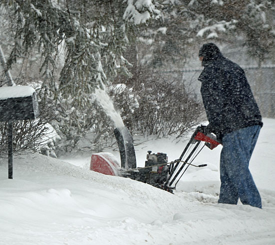 A local resident's snow blower gets some use during a storm that hit the area in January 2011. (VW independent file photo)