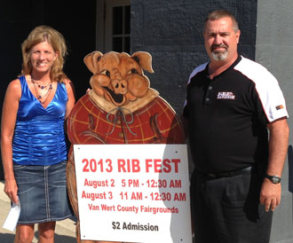 Shown at right is Jill Welch, YWCA board member, Isaac Van Snort (Rib Fest mascot) and Barry Johns from Wetzel Motorcycle Club, which sponsored a pig in every race. (photo submitted)