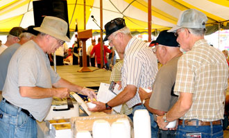 Military veterans stop in at the Entertainment Tent for free bean soup and cornbread on Friday. (Jan Dunlap/Van Wert independent)