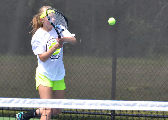 Spencerville sophomore Kaylee Davis slams a forehand in a match against Claire Butler on Saturday. (Dave Mosier/Van Wert independent)