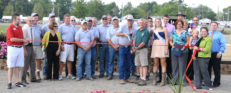 U.S. Representative Bob Latta helped cut the ribbon on the 157th edition of the Van Wert County Fair on Wednesday. Also on hand were city and county officials and Fair Board members. (Jan Dunlap/Van Wert independent)