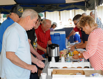 Veterans line up for bean soup and cornbread during Veterans Day at the 2012 Van Wert County Fair. (VW independent file photo)
