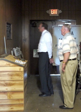 Larry Wendel and Van Wert County Foundation Trustee, Mike Gearhart inspect a commemorative plaque in the armory from 1938 during the beginning phase of the building’s transition. The plaque will remain on display. (Photo submitted.)
