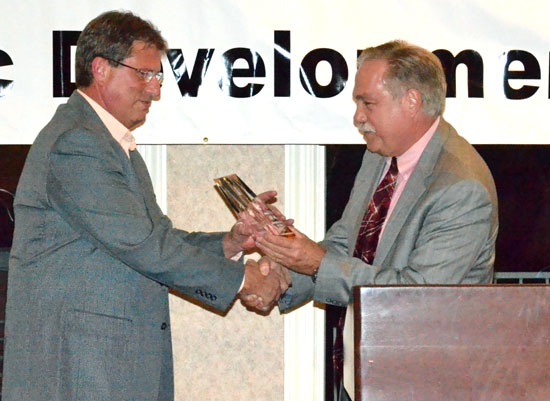 Jack Ruhe (left) of Toledo Molding & Die accepts the Large Enterprise of the Year Award from Delphos Safety-Service Director Greg Berquist. (Dave Mosier/Van Wert independent)