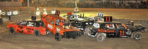 Lots of people watched as area drivers hurled their junk cars into each other during the fair's Demolition Derby held Sunday night. (Jan Dunlap/Van Wert independent)
