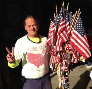 Coast-to-coast walker Armand Young poses for a photo while in Van Wert. (photo by Gary Showalter for the Van Wert independent)