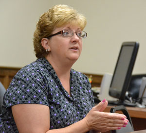 YWCA Executive Director Tammy Branham speaks with the Van Wert County commissioners about the YW's request to obtain marriage license fees for its domestic violence program. (Dave Mosier/Van Wert independent)