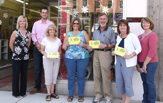 Shown receiving their downtown shopping prizes from MSVW President Denise Frey (left), MWVW Program Manager Adam Ries (second from left) and promotions member Dawn Cooper (right) are (from the left) Margaret Hipsley, Cheryl Stauffer, Rex Fortney, and Darlene Myers. (photo submitted)