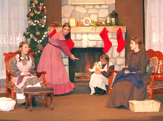 The March sisters (Meg, Jo, Beth and Amy) in a homey fireside scene from Van Wert Civic Theatre's production of "Little Women -- A Little Musical." (VWCT photo)