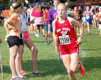 Amanda Clay runs at the Tiffin Cross Country Carnival on Saturday. (photo by Monica Campbell for the Van Wert independent)
