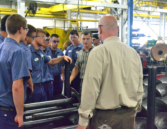 Vantage Industrial Mechanics students listen to Jeff Schulte (plaid shirt) tell them about operations at Unverferth Manufacturing's Delphos plant. (Dave Mosier/Van Wert independent)