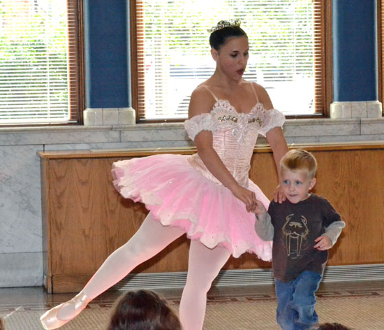 A ballerina from the Fort Wayne (Ind.) Ballet dances with a young local boy as part of the Brumback Library's Summer Reading Program in 2012. (VW independent file photo)