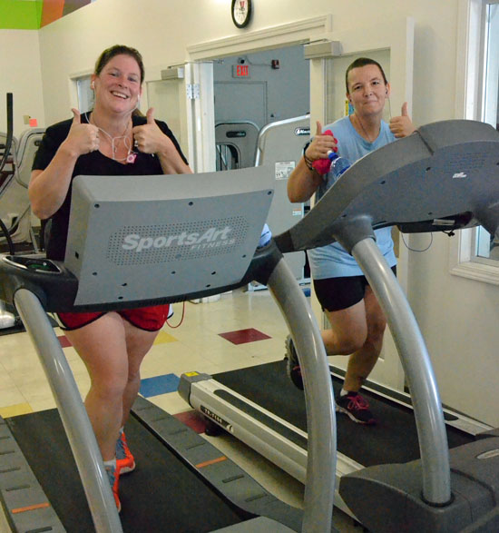 Kelly Oakley (left) and Tyla Mason work out at the Van Wert Peak Community Wellness Center as part of Peak's Big Give community weight-loss challenge. (Dave Mosier/Van Wert independent)