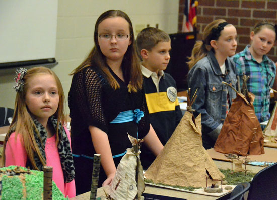 Lincolnview fifth-graders show off the Native American dwellings they made during Tuesday evening's board of education meeting. (Dave Mosier/Van Wert independent)