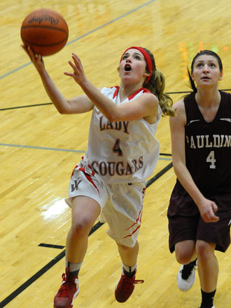 Cougar Kaitlynn Hall (4) outraces a Paulding defender for a layup in Tuesday night's non-conference game won by Van Wert, 54-20. (Jan Dunlap/Van Wert independent)