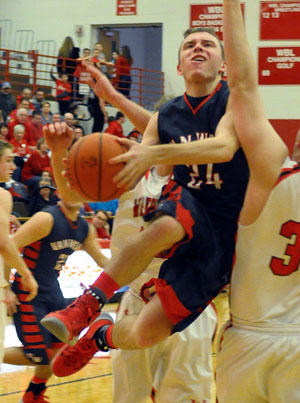 Connor Holliday (24) goes up in traffic Friday against Wapakoneta in a WBL contest won by the Redskins. (Jan Dunlap/Van Wert independent)