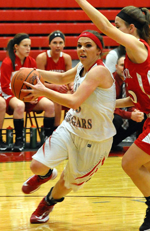 Van Wert's Cheyenne Handy (23) drives around a Wapakoneta defender during Thursday's WBL contest in the Cougar's Den won by Van Wert. (Jan Dunlap/Van Wert independent)