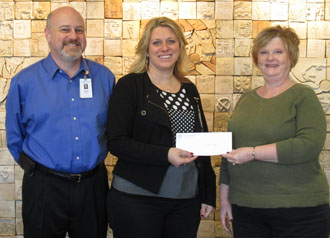 Van Wert County Hospital employees Brett Taylor and Jennifer Williams (center) present a donation check to 2013 United Way Campaign Chair Anita Carvajal. (United Way photo)