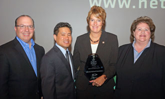 Jeanine Forwerck of Central Insurance (second from right) accepts the Quantum award from the NetVU Leadership team of (from the left) Keith Savino, vice chairman; Stephen Moriyama, chairman of the board; and Debbie Miner, chairman-elect. (Central photo)