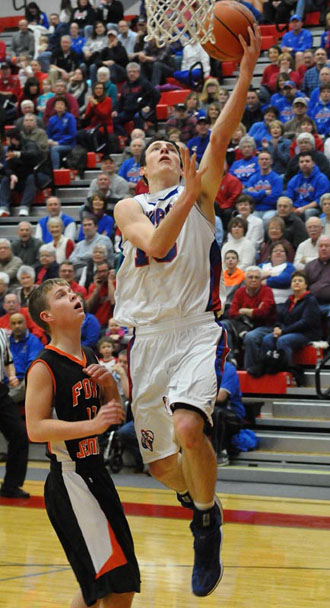 Crestview senior Damian Helm (15) goes up for a layup against Fort Jennings in a Division IV sectional title game won by the Knights, 69-29. Helm led Crestview with 20 points. (Jan Dunlap/Van Wert independent)