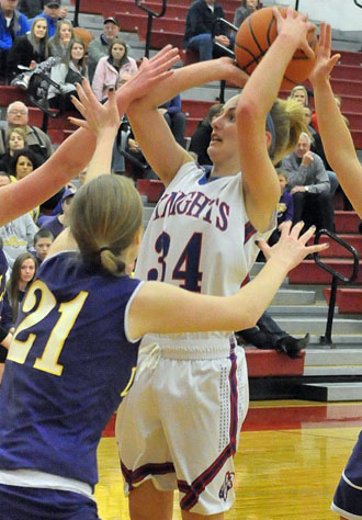 Lady Knight Lindsey Motycka (34) tries to get a shot off in traffic during Saturday's Division IV district final against Leipsic. Crestview won the game 41-33 to advance to the regional semifinals. (Jan Dunlap/Van Wert independent)