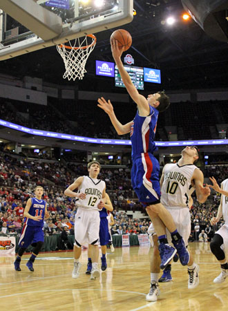 Crestview senior Damian Helm (15) puts in a layup against Louisville St. Thomas Aquinas in the Division IV state championship game won by the Knights, 71-44. Ashley Baxter/for the Van Wert independent)