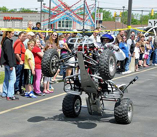 Henry "The Pitbull" Rife pops a wheelie during a show this past summer at Lee Kinstle GM Sales & Service. (photos submitted)