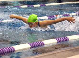 Emma Pollock competes in the 100-yard breaststroke race at the championship meet in Fremont. (photo submitted)