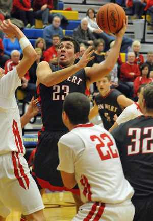 Van Wert senior Matt Bidlack (23) shows the effort as he tries to get off a shot in traffic against St. Henry in Division III sectional action at St. Marys on Friday. The Cougars lost 51-37. (Jan Dunlap/Van Wert independent)