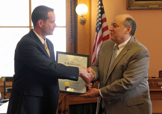 State Representative Tony Burkley (right) presents a resolution from the Ohio General Assembly to Crestview boys' basketball coach Jeremy Best honoring the Knights' Division IV state championship. (photo submitted)