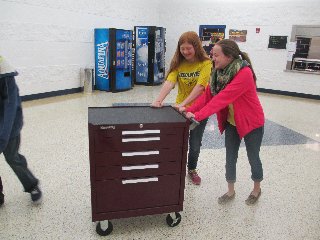 Lana Carey and Shiann Craft take the mobile store to the lower elementary grades in another wing of the building. (Photo submitted.)