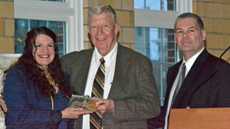 Hope Wallace and Larry Wendel (center) accept the Renovation Award from Main Street Van Wert Board member Kirk Dougal. (Dave Mosier/Van Wert independent)