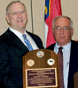 Scott Niswonger (left) holds the 2014 Donald R. Myers Humanitarian Award. (photo submitted)