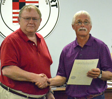 VW City Council President Ken Mengerink (left) congratulates Councilman At-Large Brent Crone, who is leaving Council after a decade of service. (Dave Mosier/Van Wert independent)
