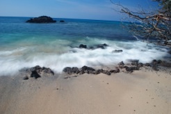 Photographing moving water with a longer shutter release produces a flowing, silky effect. This picture, taken at Waialea Bay in Hawaii required the use of a special ND or darkening filter on the lens to prevent to image from being overexposed. (Photo by Chris Wilson)