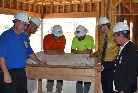 Ridge Administrator Pat Tracy (right) goes over construction project plans with County Commissioners Todd Wolfrum and Thad Lichtensteiger, while Ridgeview staffer Gregg Giessler (left) and contractor representatives look on. (Dave Mosier/Van Wert independent)
