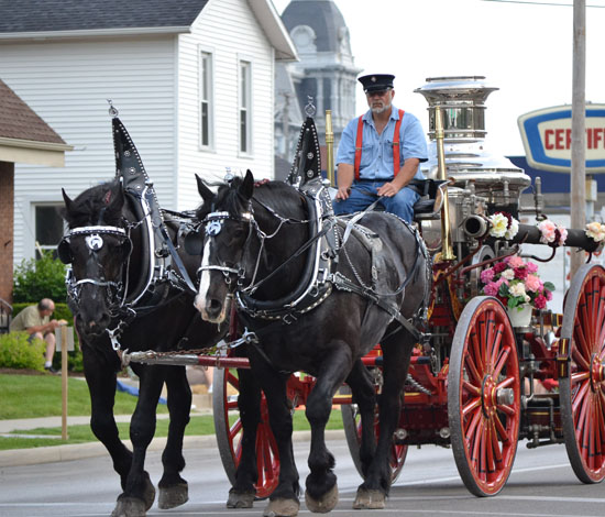 Central Insurance Company's antique horse-drawn fire engine is one of the many draws of the Peony Festival Grand Parade on Saturday afternoon. (VW independent file photo)