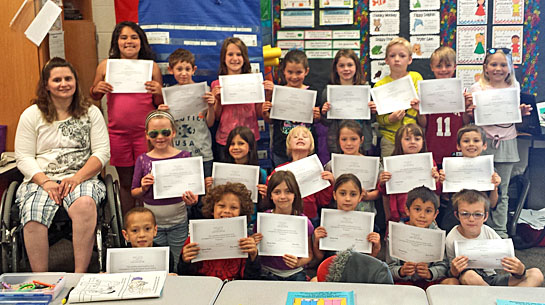Carey Partin, Safe and Secure instructor, with Amy Prichard’s first grade class after receiving their certificates for completing the program. (photo submitted)