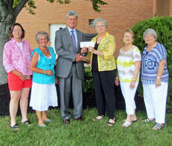 Representatives of the All-Twig Board (from the left) Sherri Arn and Arlene Gamble present a check to Van Wert County Hospital President and CEO Mark Minick, with All-Twig President LaDonna Allenbaugh and Barb Adams looking on. (VWCH photo)