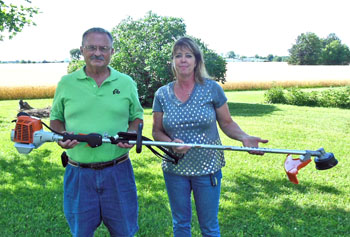 Shown with Wren’s new weed trimmer are Michael C. Stanley (left), local Elks community service chairman, and Wren Village Council Member Beth A. Marchek. (Elks photo)
