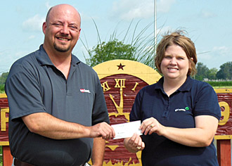 Elks Exalted Ruler Craig A. Bell (left) presents a check for $125 to Lynn Bryan of the Apple Seed Girl Scout Region. (Elks photo)