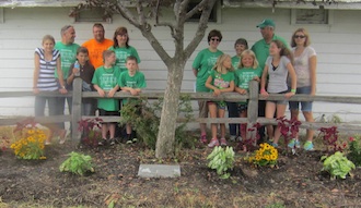  They went to the Jacob Heller memorial by the Junior Horse Arena, where they cleaned up the area and planted 14 flowers and shrubs. (Photo submitted.)