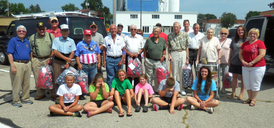 Veterans and guardians who went on an Honor Flight Dayton trip to Washington, D.C., pose with members of the Shooting Stars 4-H Club. (photo submitted)