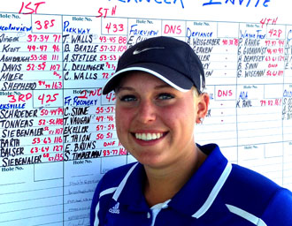 Lincolnview Invitational Medalist Mikenna Klinger poses in front of the scoreboard at Hickory Sticks Golf Club. (photo submitted)