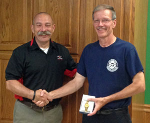 Reserve Van Wert Firefighter Mike Grew (right) and Van Wert Fire Chief Jim Steele pose during a retirement reception for Grew. (photo submitted)