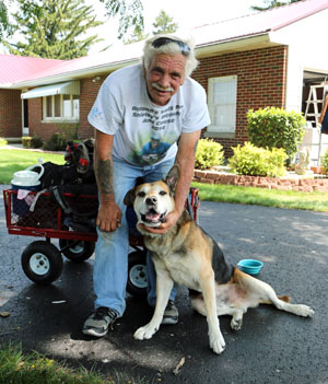 Roland and Wags pose for a photo while walking through Van Wert County. (photo by Tracy Sterling for the Van Wert independent)