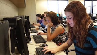 Students in seventh grade are creating power point presentations about their families, interests, and future plans. (Photo submitted.)