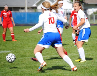 Junior Jada Preston wins the ball and dribbles it down the field. The Lady Knights lose in a close game against Lima Senior 0-1. (Photo by M. Rickard.)